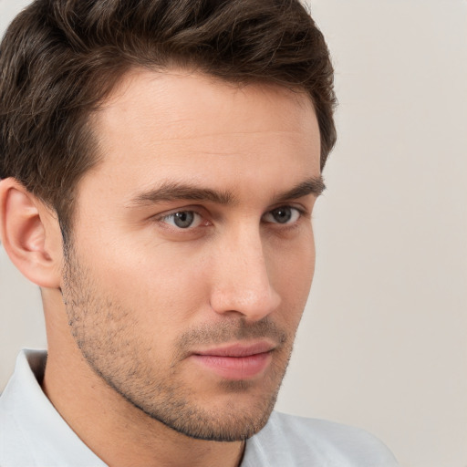 Neutral white young-adult male with short  brown hair and brown eyes