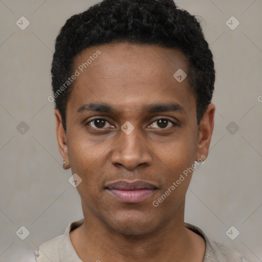 Joyful black young-adult male with short  black hair and brown eyes