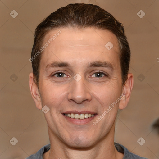 Joyful white adult male with short  brown hair and brown eyes