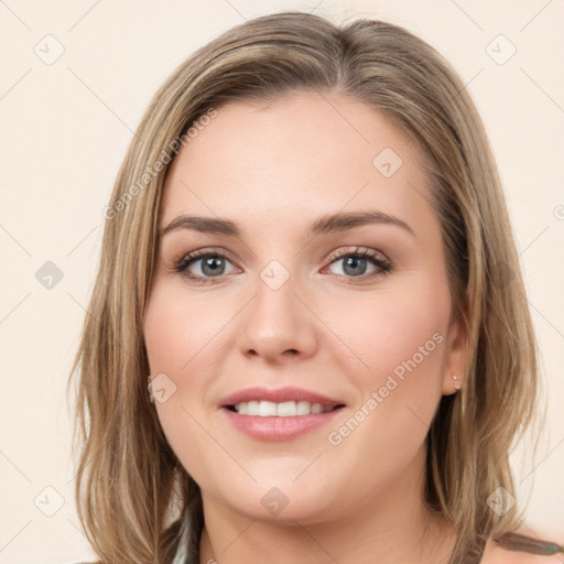 Joyful white young-adult female with long  brown hair and green eyes