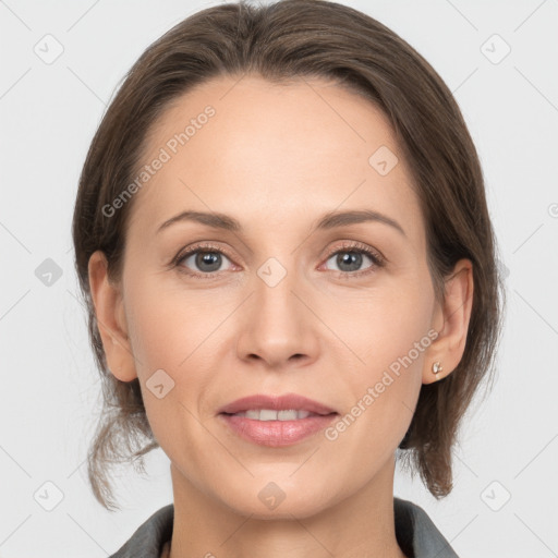 Joyful white adult female with medium  brown hair and grey eyes