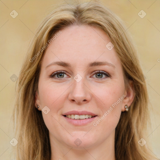 Joyful white young-adult female with long  brown hair and green eyes