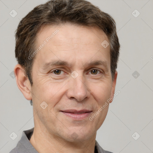 Joyful white adult male with short  brown hair and grey eyes