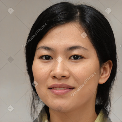 Joyful asian young-adult female with medium  black hair and brown eyes