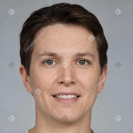 Joyful white adult male with short  brown hair and grey eyes