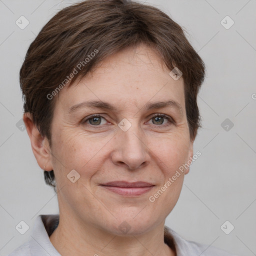 Joyful white adult female with short  brown hair and brown eyes