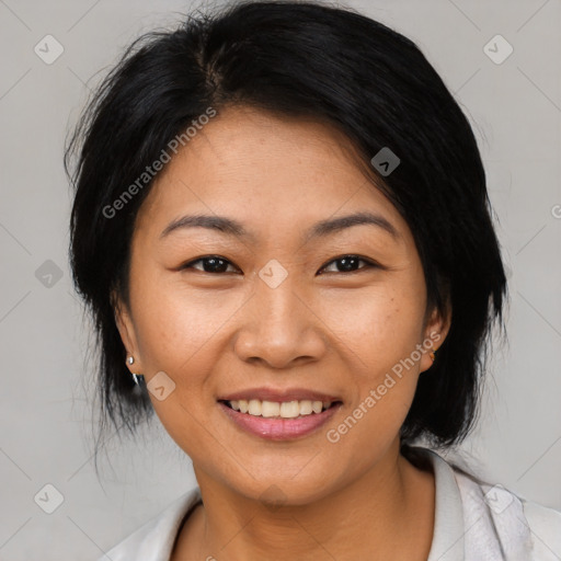 Joyful asian young-adult female with medium  black hair and brown eyes