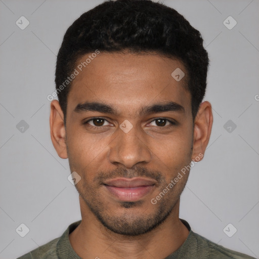 Joyful black young-adult male with short  black hair and brown eyes