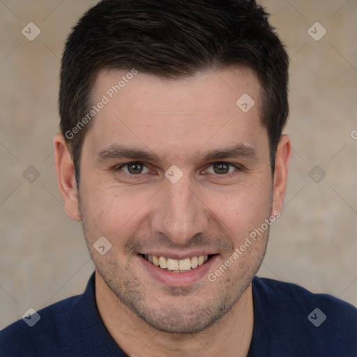 Joyful white adult male with short  brown hair and brown eyes