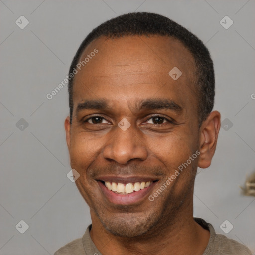 Joyful latino adult male with short  brown hair and brown eyes