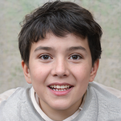 Joyful white child male with short  brown hair and brown eyes