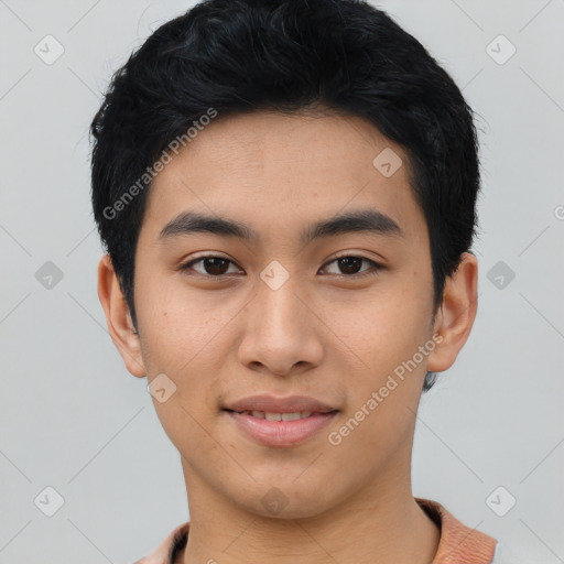 Joyful asian young-adult male with short  black hair and brown eyes