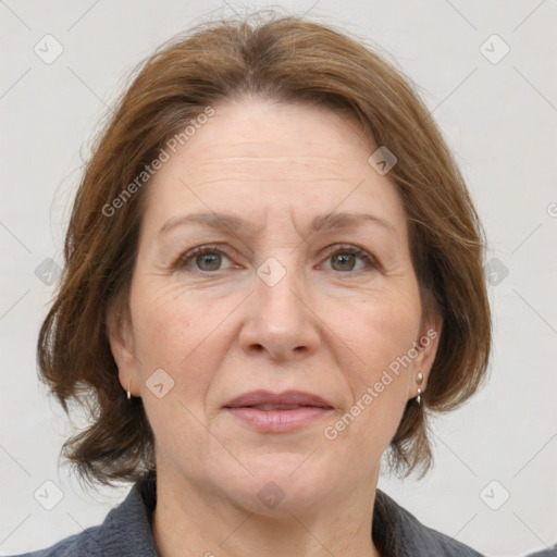 Joyful white adult female with medium  brown hair and grey eyes