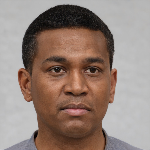 Neutral black young-adult male with short  brown hair and brown eyes