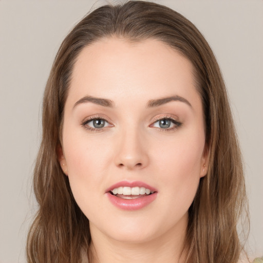 Joyful white young-adult female with long  brown hair and grey eyes