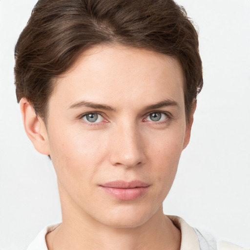 Joyful white young-adult female with short  brown hair and grey eyes