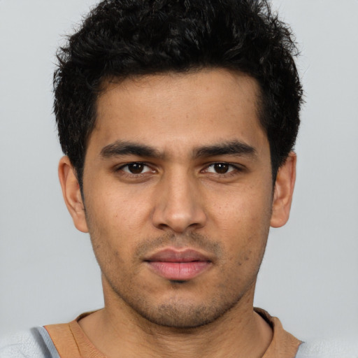 Neutral latino young-adult male with short  brown hair and brown eyes