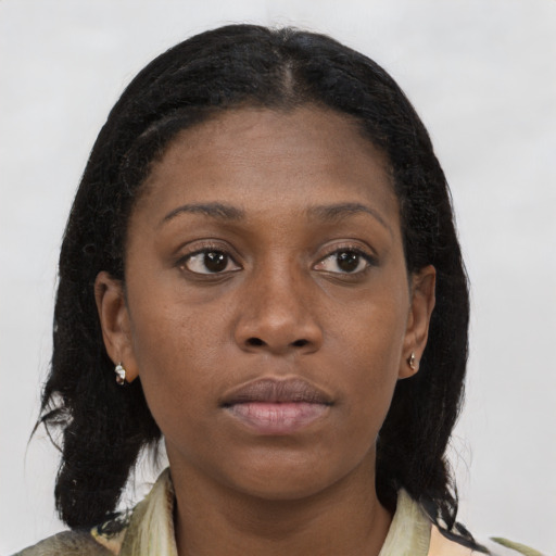 Neutral black young-adult female with medium  brown hair and brown eyes