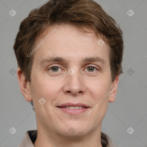 Joyful white adult male with short  brown hair and grey eyes