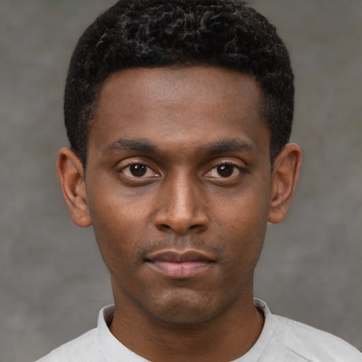 Neutral latino young-adult male with short  brown hair and brown eyes