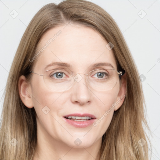 Joyful white adult female with long  brown hair and grey eyes