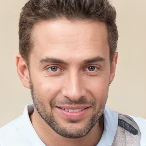 Joyful white young-adult male with short  brown hair and brown eyes