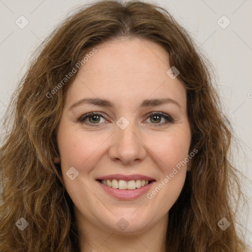 Joyful white young-adult female with long  brown hair and green eyes