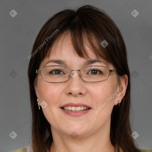 Joyful white adult female with medium  brown hair and grey eyes