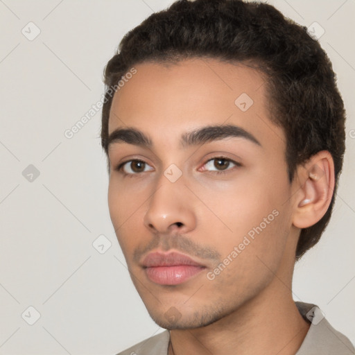 Neutral white young-adult male with short  black hair and brown eyes