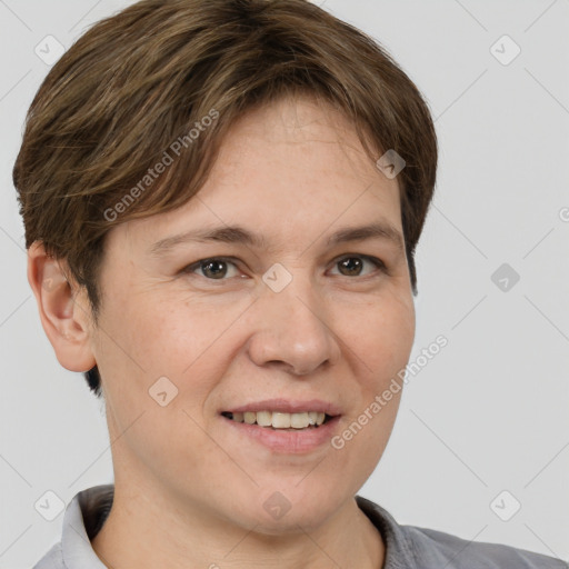 Joyful white adult female with short  brown hair and brown eyes