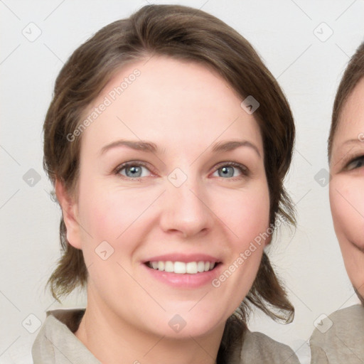 Joyful white young-adult female with medium  brown hair and blue eyes