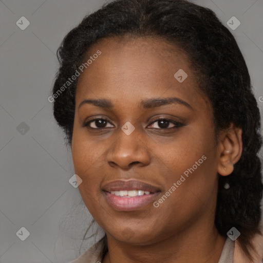 Joyful black young-adult female with long  brown hair and brown eyes