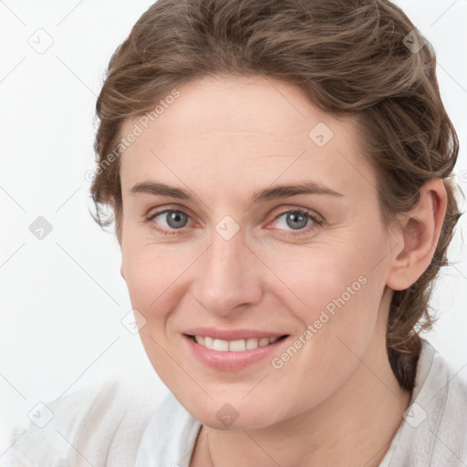 Joyful white young-adult female with medium  brown hair and blue eyes