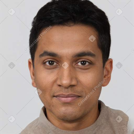 Joyful latino young-adult male with short  black hair and brown eyes