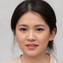 Joyful asian young-adult female with medium  brown hair and brown eyes