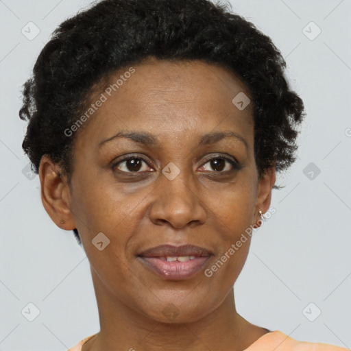Joyful black adult female with short  brown hair and brown eyes