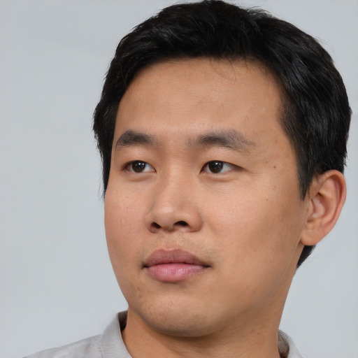 Neutral asian young-adult male with short  black hair and brown eyes