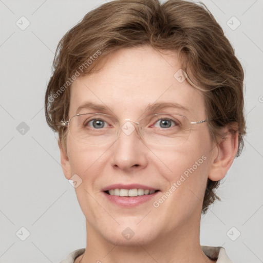 Joyful white adult female with short  brown hair and grey eyes