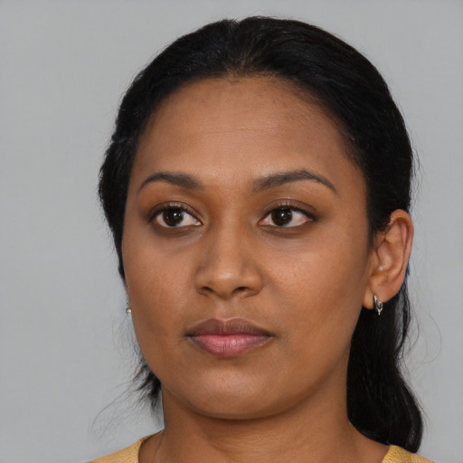 Neutral black young-adult female with medium  black hair and brown eyes