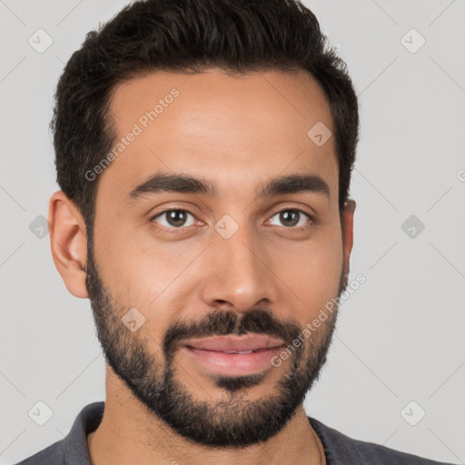 Joyful white young-adult male with short  black hair and brown eyes