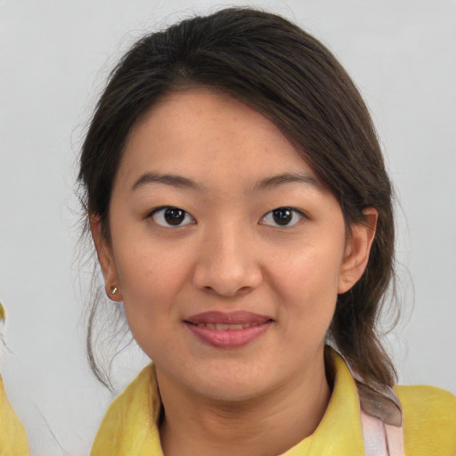 Joyful asian young-adult female with medium  brown hair and brown eyes