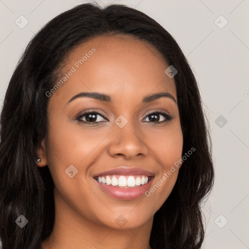 Joyful latino young-adult female with long  brown hair and brown eyes