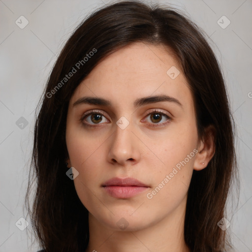 Neutral white young-adult female with long  brown hair and brown eyes