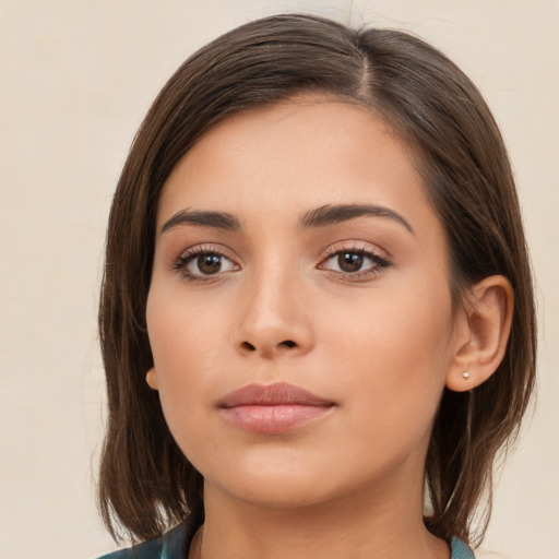 Neutral white young-adult female with medium  brown hair and brown eyes