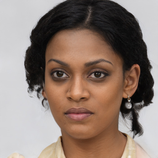 Neutral black young-adult female with long  brown hair and brown eyes