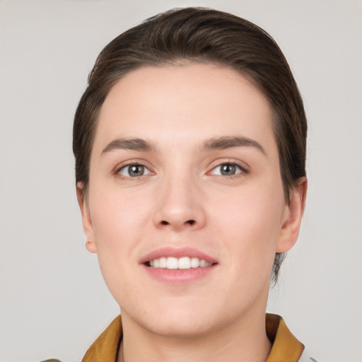 Joyful white young-adult female with short  brown hair and brown eyes