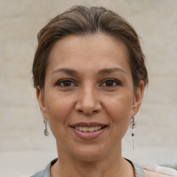 Joyful white adult female with short  brown hair and brown eyes