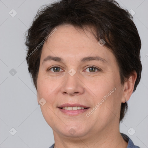 Joyful white adult female with short  brown hair and brown eyes