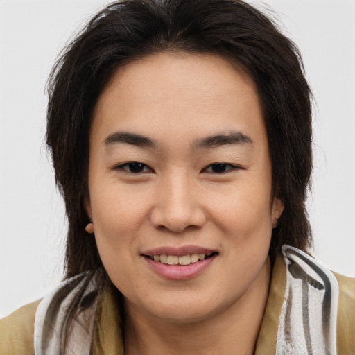 Joyful asian young-adult female with medium  brown hair and brown eyes