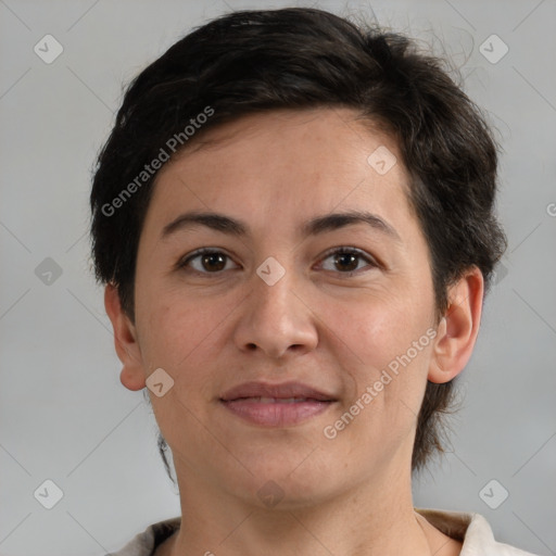 Joyful white adult female with short  brown hair and brown eyes